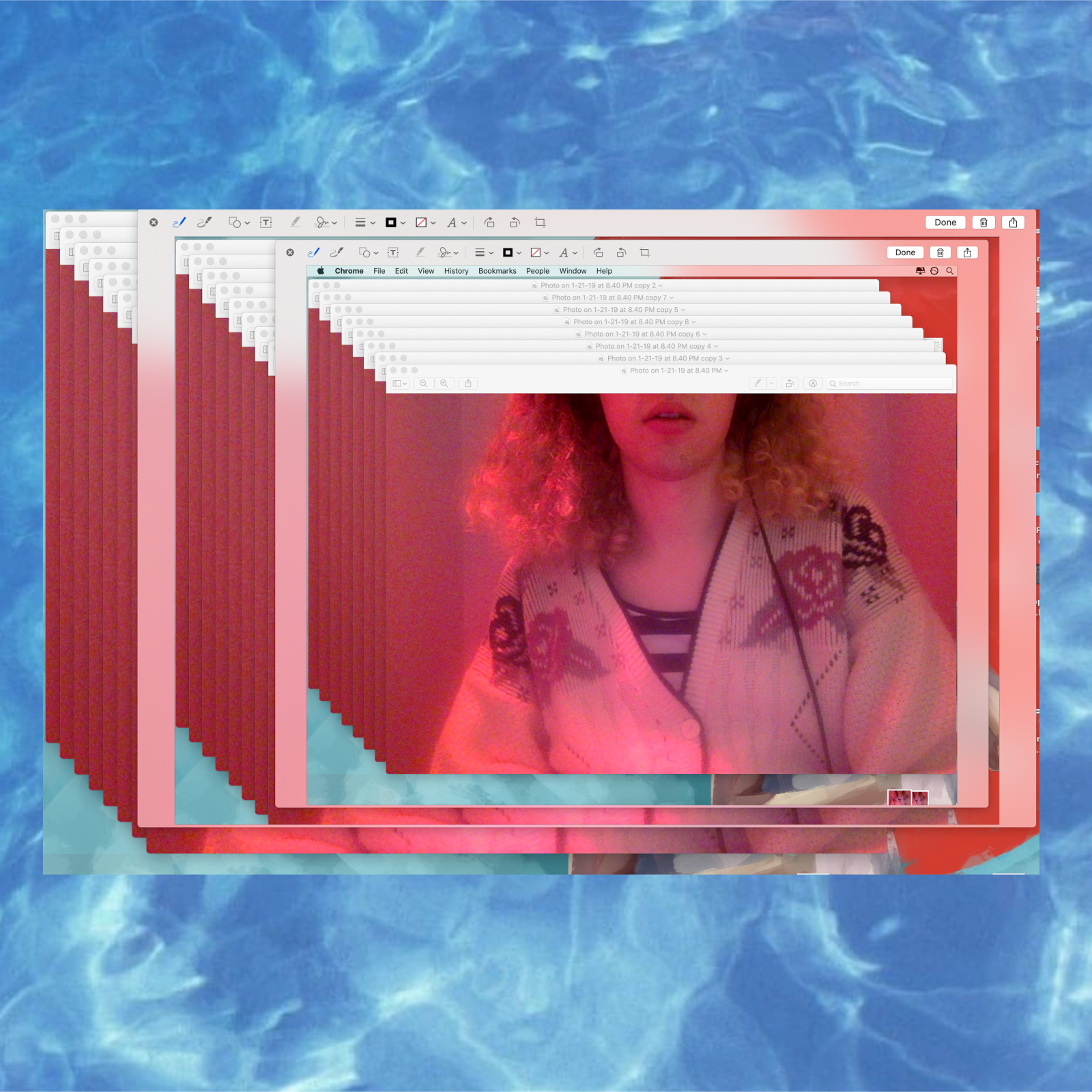 picture of willow's torso and lower-face with pink hair, lips, lighting, and floral design on an oversized white cardigan. 